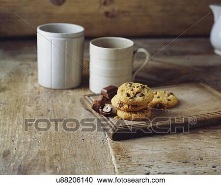 Chocolate and hazelnut cookies on vintage wooden cutting board View Large Photo Image Stock Image - Chocolate and hazelnut cookies on vintage wooden cutting board. Fotosearch