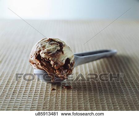 Chocolate chip and vanilla ice cream in metal scoop View Large Photo Image Stock Image - Chocolate chip and vanilla ice cream in metal scoop. Fotosearch