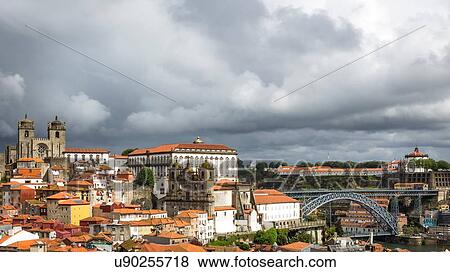 Stock Photo - Cityscape, including Dom Luis I Bridge, Porto Cathedral and Igreja dos Grilos, Porto, Portugal. Fotosearch