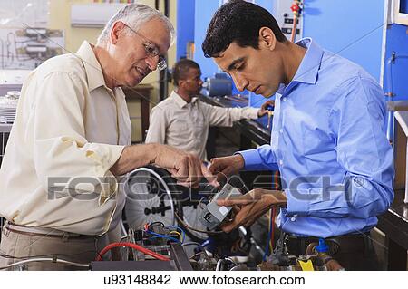 Stock Image - Classroom with one student in wheelchair. Fotosearch