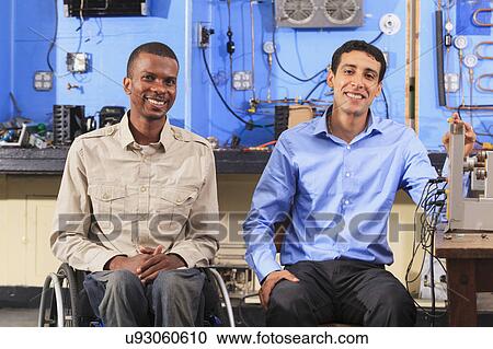Stock Image - Classroom with student in wheelchair. Fotosearch