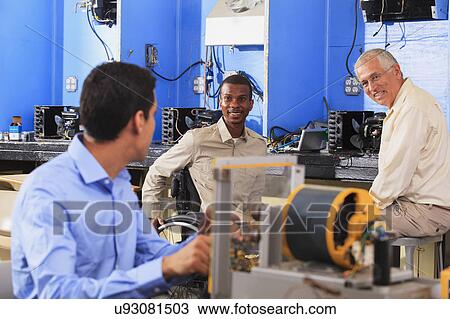 Stock Image - Classroom with student in wheelchair. Fotosearch