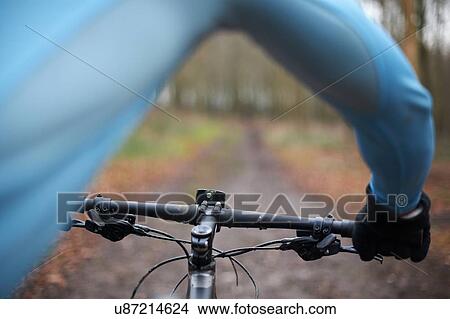 Picture - Close up of cyclist and handlebars of bike. Fotosearch
