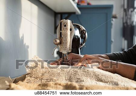Close up of womans hands sewing textiles on vintage sewing machine View Large Photo Image Stock Image - Close up of womans hands sewing textiles on vintage sewing machine. Fotosearch