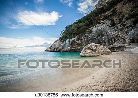 Coastline and rocky beach, Ogliastra, Sardinia, Italy View Large Photo Image Stock Photograph - Coastline and rocky beach, Ogliastra, Sardinia, Italy. Fotosearch