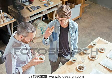 Coffee business owner and customer discussing coffee View Large Photo Image Stock Photography - Coffee business owner and customer discussing coffee. Fotosearch