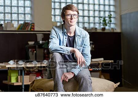 Coffee business owner sitting on sack of coffee beans View Large Photo Image Stock Image - Coffee business owner sitting on sack of coffee beans. Fotosearch