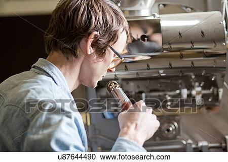 Coffee business owner sniffing coffee beans View Large Photo Image Stock Image - Coffee business owner sniffing coffee beans. Fotosearch