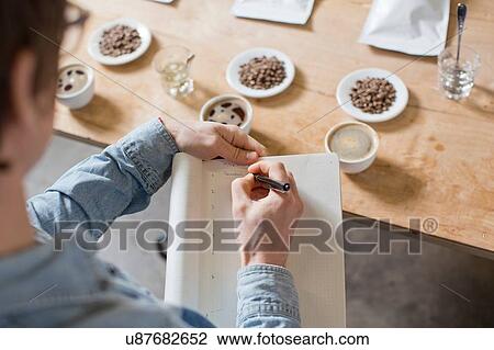 Coffee taster writing notes View Large Photo Image Stock Image - Coffee taster writing notes. Fotosearch