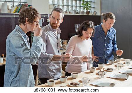 Coffee tasters sipping coffee with spoon View Large Photo Image Stock Image - Coffee tasters sipping coffee with spoon. Fotosearch