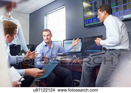 Picture - Colleagues in office having discussion, hand gestures. Fotosearch