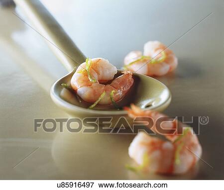 Stock Photo - Cooked prawns in spoon. Fotosearch