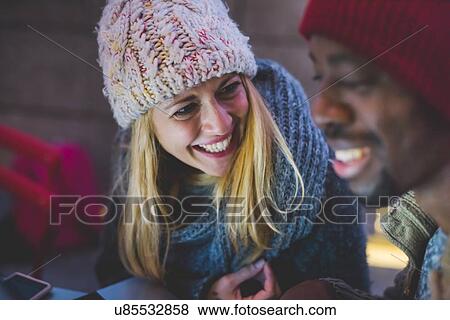 Stock Photo - Couple chatting and smiling. Fotosearch