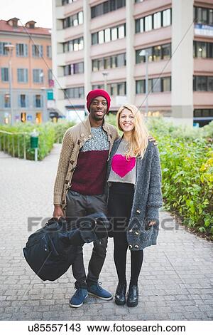 Couple with guitar standing on walkway View Large Photo Image Stock Image - Couple with guitar standing on walkway. Fotosearch