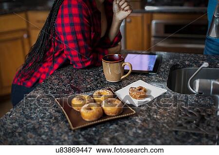 Cropped shot of mid adult couple at kitchen counter View Large Photo Image Stock Photo - Cropped shot of mid adult couple at kitchen counter. Fotosearch