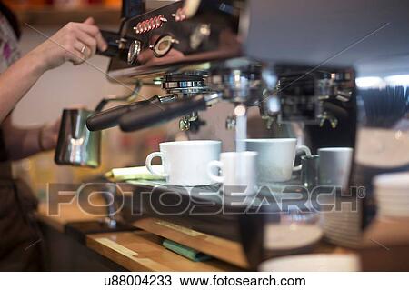 Cropped shot of waitress's using coffee machine in cafe View Large Photo Image Stock Image - Cropped shot of waitress's using coffee machine in cafe. Fotosearch