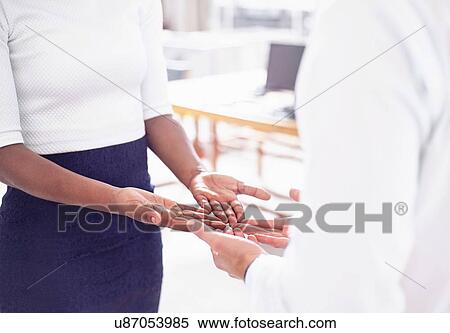 Cropped view of couple face to face, open hands together View Large Photo Image Stock Photography - Cropped view of couple face to face, open hands together. Fotosearch