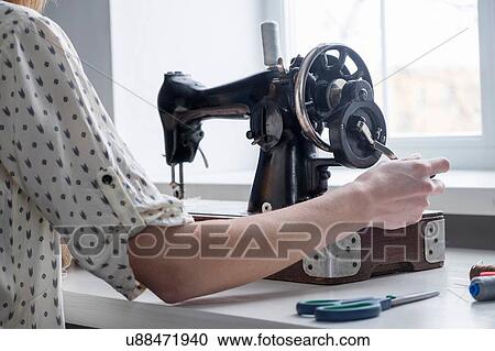 Cropped view of woman using vintage sewing machine View Large Photo Image Stock Image - Cropped view of woman using vintage sewing machine. Fotosearch