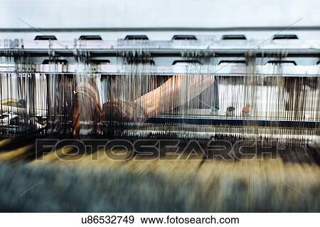 Detail of factory workers hands working on weaving machine View Large Photo Image Stock Photo - Detail of factory workers hands working on weaving machine. Fotosearch