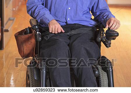 Stock Image - Disabled man in his kitchen. Fotosearch