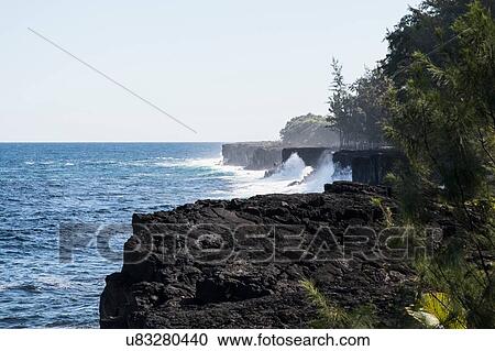 Stock Image - "Elevated view of ocean waves and coastal cliffs, Hana, Hawaii, USA". Fotosearch