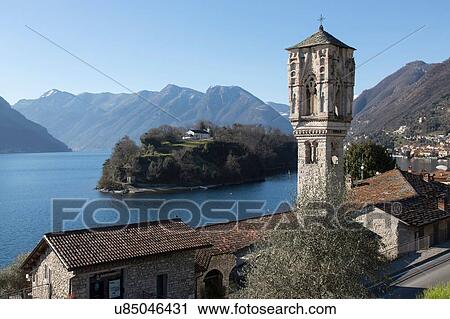 Stock Image - Elevated view of rooftops and church bell tower, Lake Como, Italy. Fotosearch