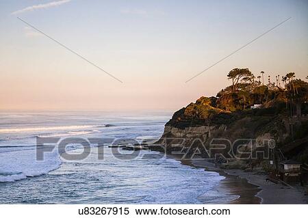 Stock Photography - "Elevated view of sea and coast at dusk, Encinitas, California, USA". Fotosearch