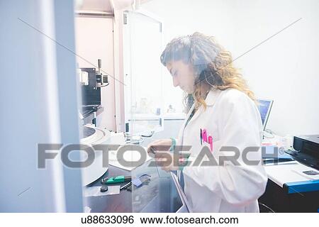 Female scientist preparing thin film sample for measurement with x-ray diffractometer View Large Photo Image Stock Photograph - Female scientist preparing thin film sample for measurement with x-ray diffractometer. Fotosearch