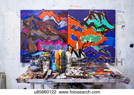 Stock Image - Finished painting and artist's material and tools. Fotosearch