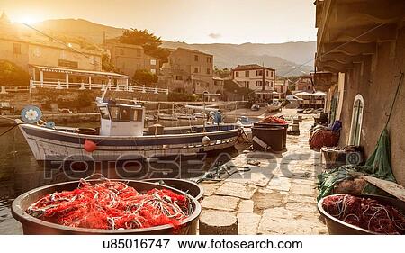 Stock Photo - Fishing boats moored in harbour, Centuri, Corsica, France. Fotosearch