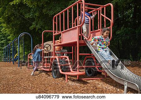 Four boys and girls playing on playground swing View Large Photo Image Stock Photo - Four boys and girls playing on playground swing. Fotosearch