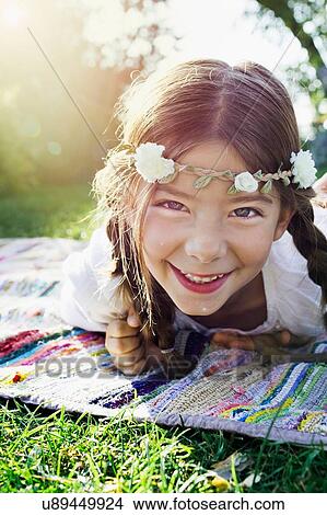 Girl with flowers round head, portrait View Large Photo Image Picture - Girl with flowers round head, portrait. Fotosearch