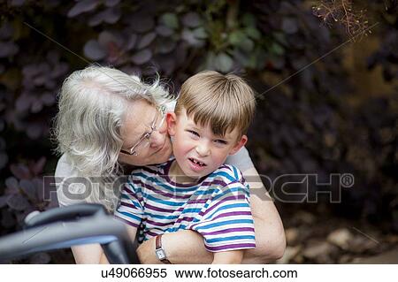 Stock Photography - Grandmother hugging grandson. Fotosearch