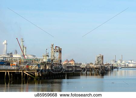 Stock Photo - Harbour with oil terminal at refinery, Rotterdam, Zuid-Holland, The Netherlands. Fotosearch