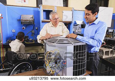 Stock Photography - Instructor training students. Fotosearch