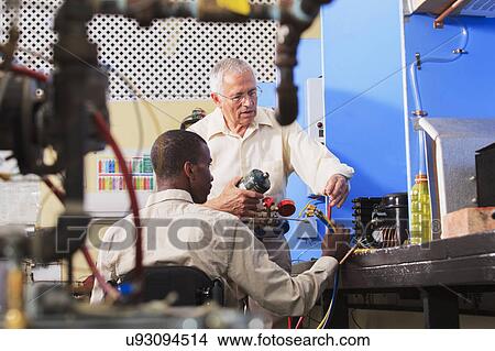 Picture - Instructor with student in wheelchair. Fotosearch