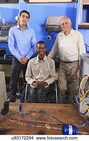 Picture - Instructor with student in wheelchair. Fotosearch