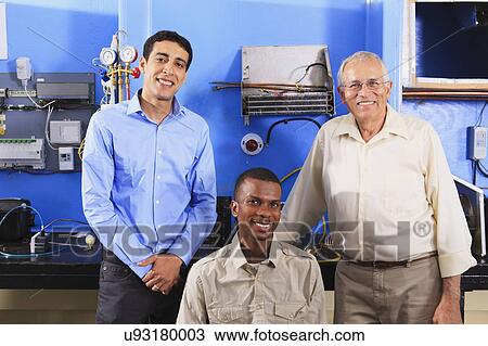Stock Image - Instructor with student in wheelchair. Fotosearch