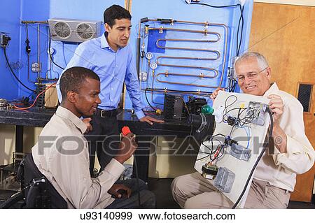 Stock Photo - Instructor with student in wheelchair. Fotosearch