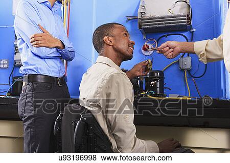 Instructor with student in wheelchair View Large Photo Image Stock Photo - Instructor with student in wheelchair. Fotosearch