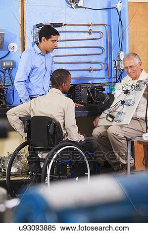 Instructor with student in wheelchair View Large Photo Image Stock Photography - Instructor with student in wheelchair. Fotosearch