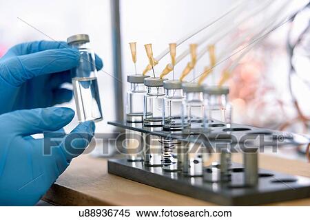 Stock Photography - Laboratory worker testing oil samples. Fotosearch