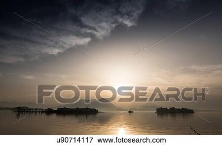 Lake Maggiore at dusk, Piedmont, Lombardy, Italy View Large Photo Image Stock Photo - Lake Maggiore at dusk, Piedmont, Lombardy, Italy. Fotosearch