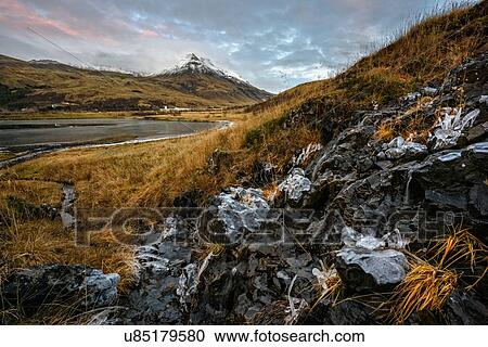 Landscape view of frozen ice on rocks and mount Esja, Reykjavik, Iceland View Large Photo Image Stock Image - Landscape view of frozen ice on rocks and mount Esja, Reykjavik, Iceland. Fotosearch