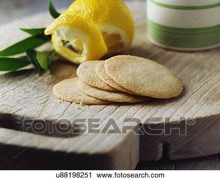 Lemon shortbread thins on vintage wooden cutting board View Large Photo Image Stock Image - Lemon shortbread thins on vintage wooden cutting board. Fotosearch