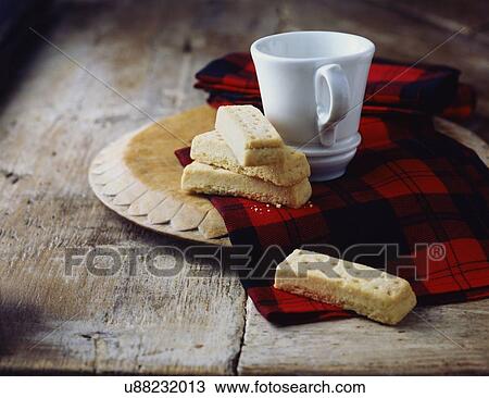 Stock Image - Luxury Scottish all butter shortbread fingers on tartan tea towel. Fotosearch