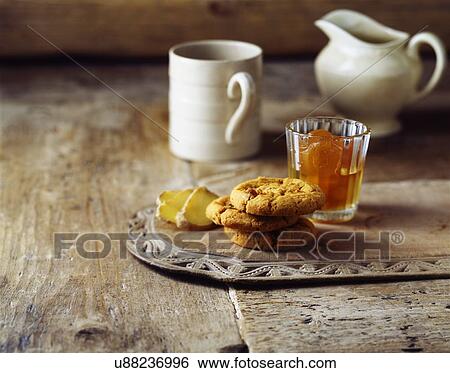 Stock Photograph -  Luxury stem ginger cookies on vintage wooden cutting board. Fotosearch