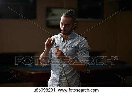 Man chalk rubbing pool cue View Large Photo Image Stock Image - Man chalk rubbing pool cue. Fotosearch