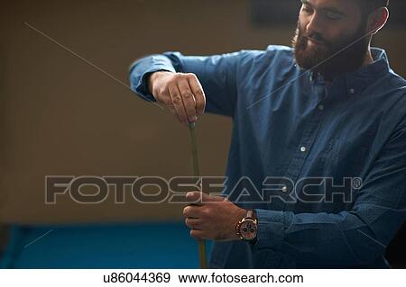 Man chalk rubbing pool cue View Large Photo Image Stock Photo - Man chalk rubbing pool cue. Fotosearch
