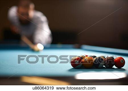 Man playing pool in club View Large Photo Image Stock Photo - Man playing pool in club. Fotosearch